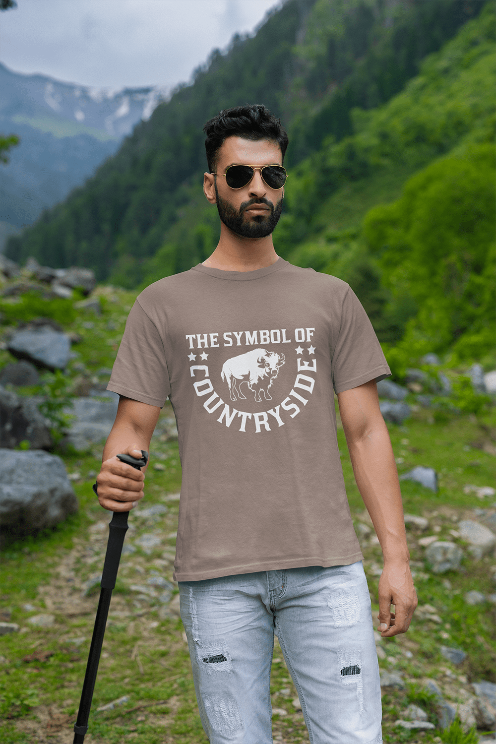 round-neck-tee-mockup-of-a-bearded-man-hiking-on-a-mountain-m35567-min
